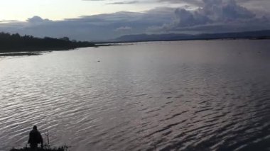 A man fishing in the afternoon