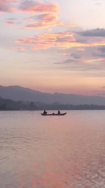 Vertical Video Fisherman Silhouette His Boat — стоковое видео