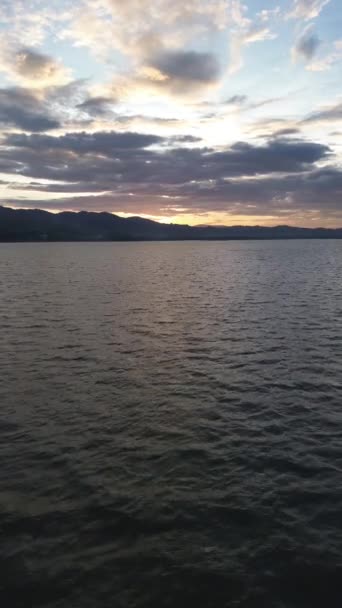 Vertical Drone Footage Limboto Lake Mountains Sunset — Stockvideo