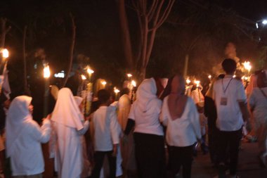 People Celebrating a Torch Relay During the Holy Month of Ramadan clipart