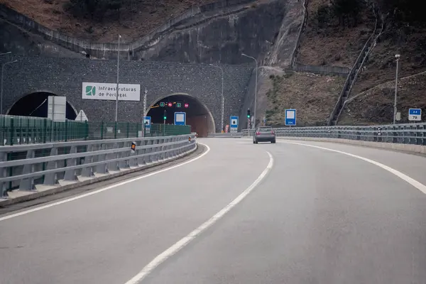 Tunnel entrance. Tunel do Marao is a road tunnel located in Portugal that connects Amarante to Vila Real, crossing the Serra do Marao. - Concept of hope, the light at the end of the tunnel.