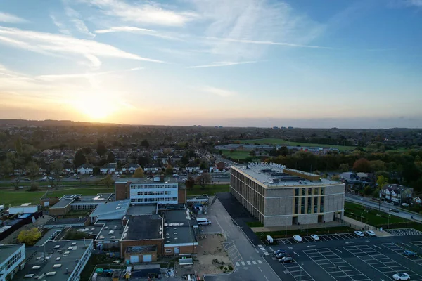 stock image ENGLAND, LUTON - 26TH OCTOBER, 2022: Beautiful Aerial View of Barnfield College for Higher Education at Barton Road Luton, England. High Angle Drone Camera View During Sunset.