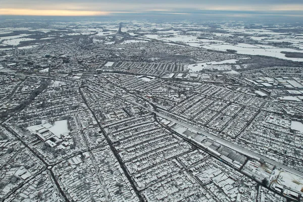 High angle view of Snow covered North Luton\'s landscape and Cityscape, Aerial Footage of Northern Luton City of England UK after Snow Fall. The 1st Snow Fall of this Winter of 2022