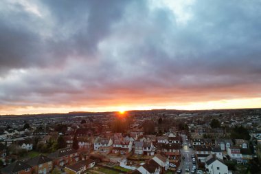 Beautiful Orange Sunset and Clouds over City  