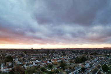 Beautiful Orange Sunset and Clouds over City  