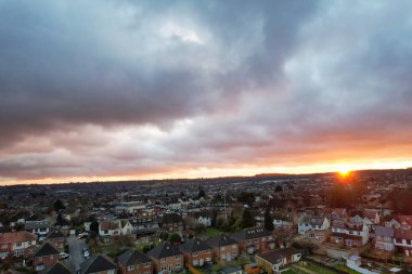 Beautiful Orange Sunset and Clouds over City  