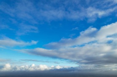 Dramatic Clouds and Blue Sky over City