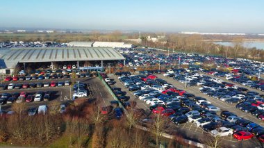 UNITED KINGDOM, BEDFORD - 6TH FEBRUARY, 2023: Aerial View of Huge and Big Car Parking of Local Car Sales Auctions at Kempston Bedford Town of England United Kingdom