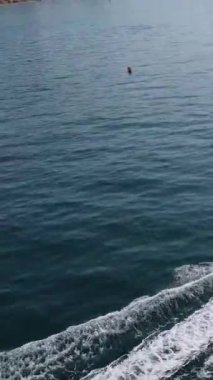 Aerial Footage of people are Relaxing and swimming in the Ocean Water at Beach of Bournemouth England UK