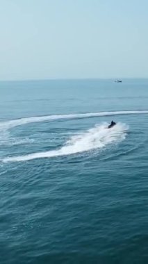 Aerial Footage of people are Relaxing and swimming in the Ocean Water at Beach of Bournemouth England UK