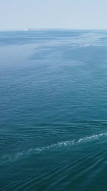Aerial Footage of people are Relaxing and swimming in the Ocean Water at Beach of Bournemouth England UK