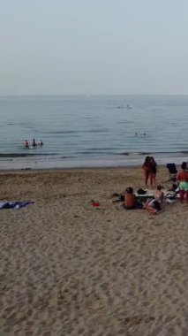 Aerial Footage of people are Relaxing and swimming in the Ocean Water at Beach of Bournemouth England UK