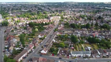 Aerial footage by drone high angle view of London Luton City of England with Buildings