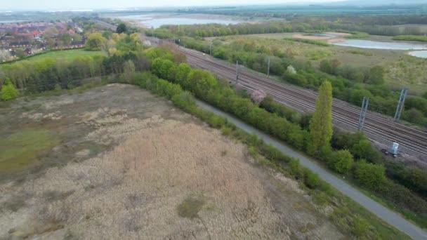 Aerial Footage Train Tracks Which Passing Stewartby Lake Countryside Bedford — Stock Video