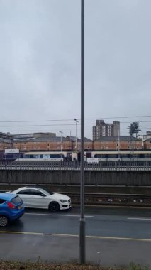 Aerial footage and high angle Train on Tracks at Central Luton Railway Station and City Centre of Luton Town of England UK