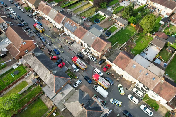 stock image High Angle Drone's Camera Footage of Fire Fighters and Rescue Team Along Police as Well. The Fire Started at Home Around 5:40pm.  Image Was Captured on 18:35 UK Time on 19th May 2023 at Luton England.