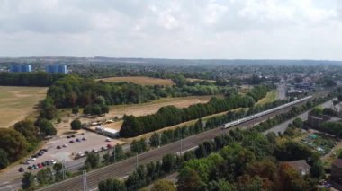 Aerial footage and high angle Train on Tracks at Central Luton Railway Station and City Centre of Luton Town of England UK