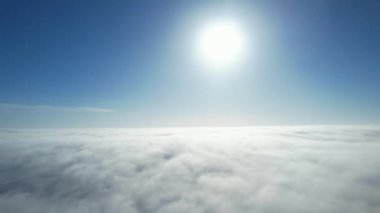 Most Beautiful Aerial View of Above the Clouds in the Morning. Dramatically fast moving clouds