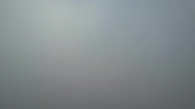 Most Beautiful Aerial View of Above the Clouds in the Morning. Dramatically fast moving clouds