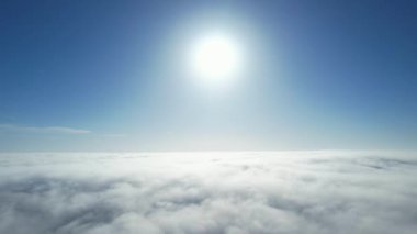 Most Beautiful Aerial View of Above the Clouds in the Morning. Dramatically fast moving clouds