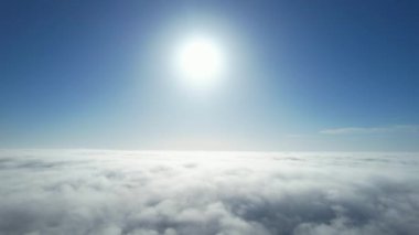 Most Beautiful Aerial View of Above the Clouds in the Morning. Dramatically fast moving clouds
