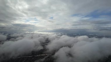 Most Beautiful Aerial View of Above the Clouds in the Morning. Dramatically fast moving clouds