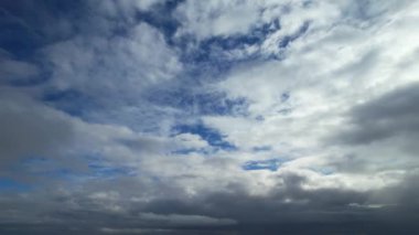 Most Beautiful Aerial View of Above the Clouds in the Morning. Dramatically fast moving clouds