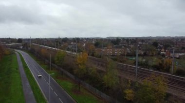 Aerial footage and high angle Train on Tracks at Central Luton Railway Station and City Centre of Luton Town of England UK