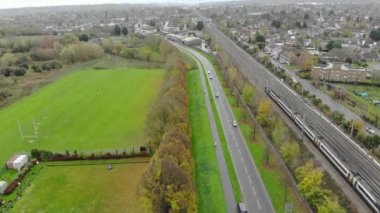 Aerial footage and high angle Train on Tracks at Central Luton Railway Station and City Centre of Luton Town of England UK