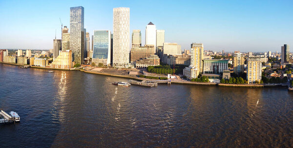 High Angle Panoramic View of Canary Wharf Buildings at Central London City of England Great Britain. The Footage Was Captured with Drone's Camera at Low Altitude on 08-June-2023 During Clear Weather's Warm Day.
