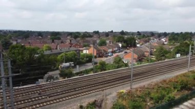 Aerial view of British Town Centre of Luton England with Railway Station and Train on Track