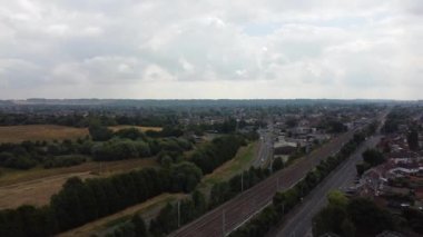 Aerial view of British Town Centre of Luton England with Railway Station and Train on Track