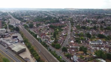 Aerial view of British Town Centre of Luton England with Railway Station and Train on Track