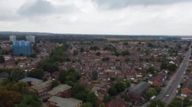 Aerial view of British Town Centre of Luton England with Railway Station and Train on Track