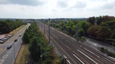 Aerial view of British Town Centre of Luton England with Railway Station and Train on Track