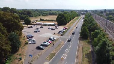 Aerial view of British Town Centre of Luton England with Railway Station and Train on Track