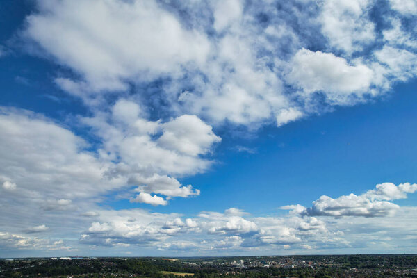 White fluffy clouds on the blue sky background