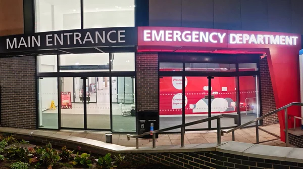 stock image Low Angle Illuminated View of Emergency Entrance of Luton and Dunstable Hospital at Luton City of England UK During Midnight of September 3rd, 2023. Hospital's Building is Under construction for Renovation