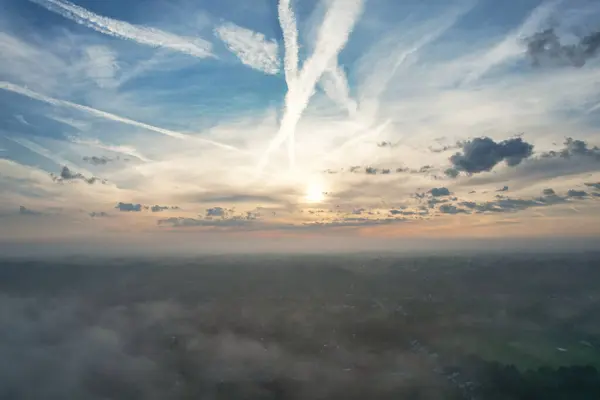 Most Beautiful and Best High Angle Footage of Dramatical Colourful Sky from Above The Clouds. The Fast Moving Clouds During Sun rising Early in the Morning over Luton City of England UK