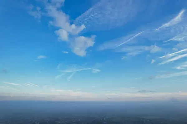 Most Beautiful and Best High Angle Footage of Dramatical Colourful Sky from Above The Clouds. The Fast Moving Clouds During Sun rising Early in the Morning over Luton City of England UK
