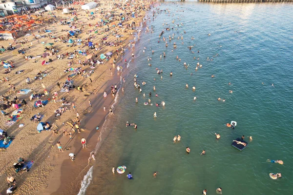 stock image Aerial View of Many People are Enjoying Hot Summer's Day over England at Bournemouth Sandy Beach During Their Holidays. Most Beautiful Tourist Attraction Captured with Drone's Camera on Sep 9th, 2023, England UK