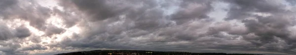 High Angle Panoramic View of Dramatic Sky and clouds over Luton City of England UK After Sunset. Image Captured with Drone\'s Camera on September 27th, 2023