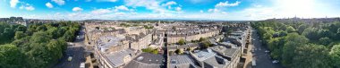 High Angle Wide Panoramic View of Central Edinburgh City of Scotland United Kingdom During Partly Cloudy Day of August 29th, 2024 clipart