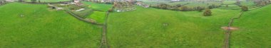 High Angle Panoramic View of British Agricultural Farms at Gorgeous Countryside Landscape of England Great Britain of United Kingdom. Footage Was Captured with Drone's Camera from Medium High Altitude. clipart