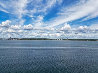 High Angle View of Hythe Town's Ocean and Beach in Kent, England Great Britain. Aerial Footage of Ferry and Boats in the Ocean Was Captured with Drone's Camera During Hot Weather of May 17th, 2024 clipart