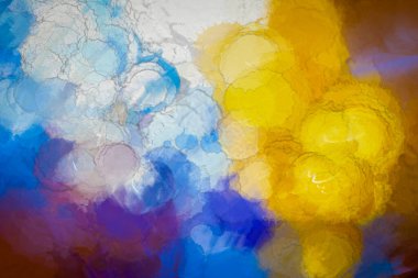 This vibrant abstract image features a blend of blue, yellow, and purple watercolor hues, creating a dynamic and captivating visual experience, ideal for artistic and creative projects. clipart