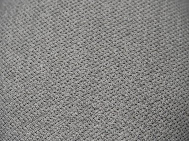 Macro of gray fabric speaker to add subtle texture to your background.