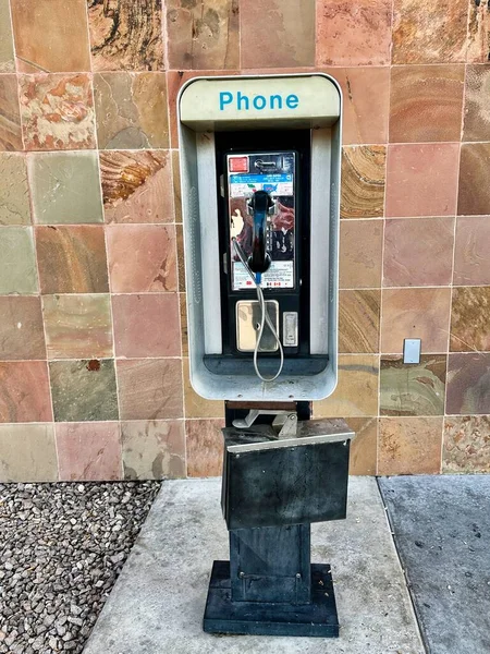 stock image An old payphone that is still in service at a Las Vegas Nevada bus station