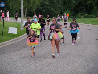 Overland Park, Kansas - July 21, 2024: Diva Dash 5k and 10k at Corporate Woods in Overland Park, KS clipart