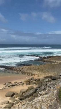 a beautiful shot of a beach at the day time.